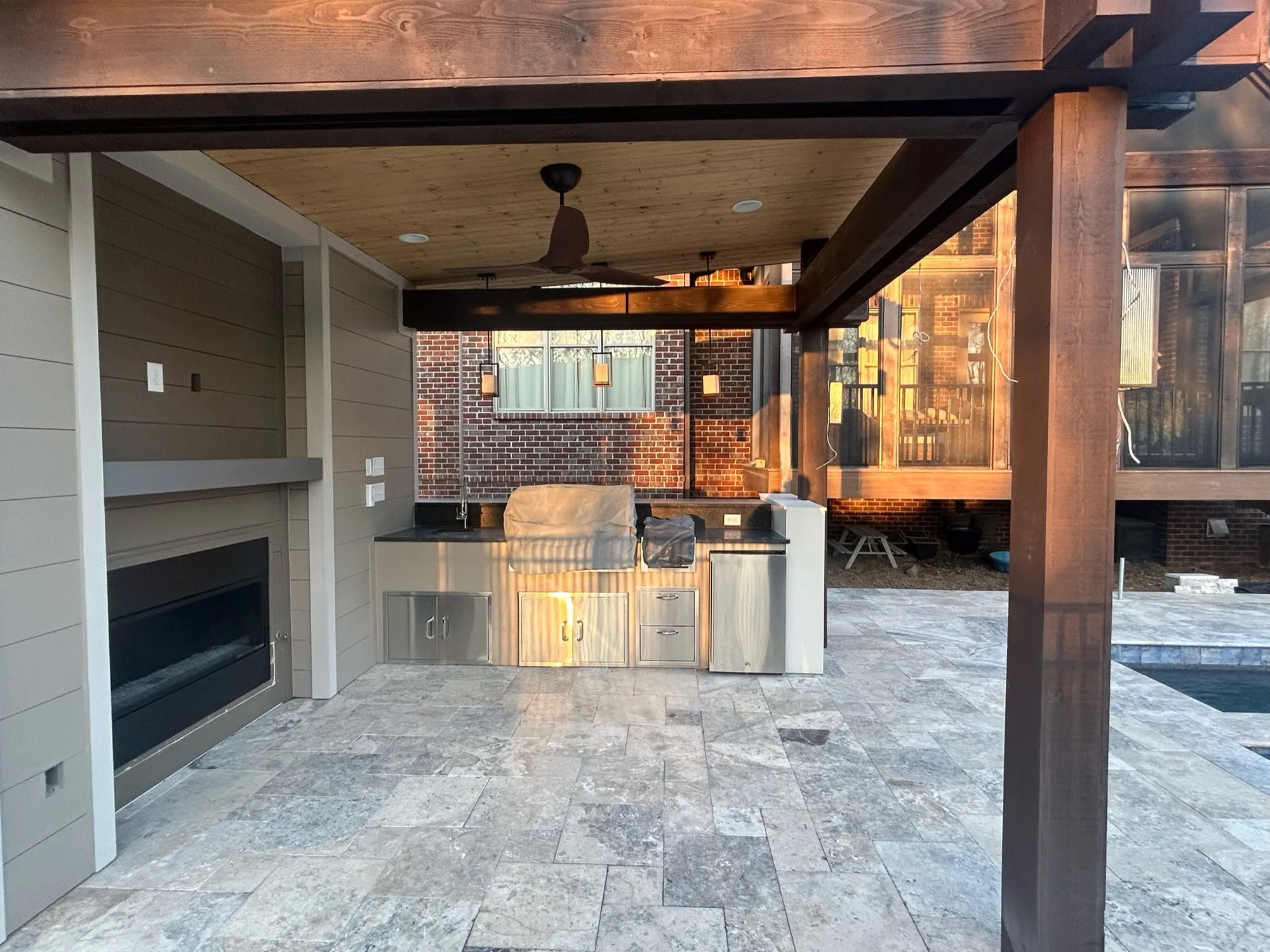 Poolside pavilion with an outdoor kitchen built by Southern Belle Construction